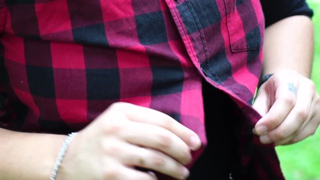 Lesbian Girl hands getting buttons done
