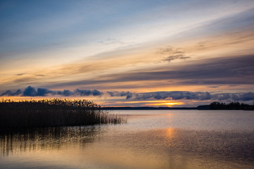 Sunrise over the Swiecajty lake near Wegorzewo, Masuria, Poland - obrazy, fototapety, plakaty