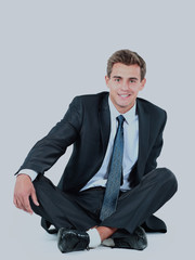 business man sitting isolated on a white background.