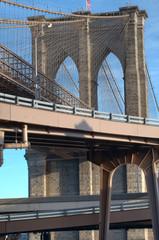 Detail of the Brooklyn Bridge neo-Gothic arches and steel suspension cables, civil engineering masterpiece, New York City