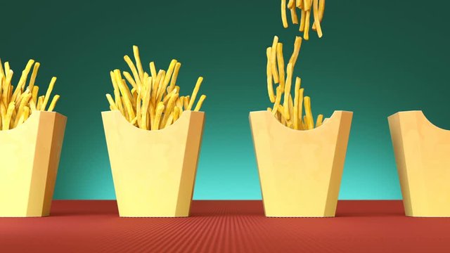 Fried potato chips in paper boxes moving on the production line  Paper boxes with french fries  down from top. Popular fast food, junk food background texture pattern