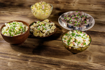 Various festive dishes on wooden table