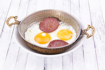 Frying eggs with sausage, Turkish Breakfast