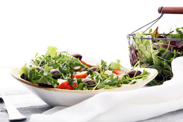 Salad with cheese and fresh vegetables and arugula. Greek salad.