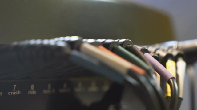 Close up of some electric drums wires, focus changing.