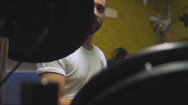 Drummer playing his electric drums, camera zooming in and moving from left to right.