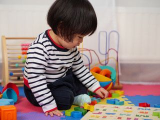 baby girl play toy at home