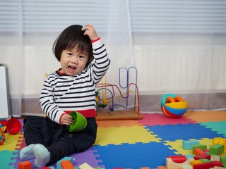 baby girl play toy at home