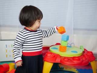 baby girl play toy at home