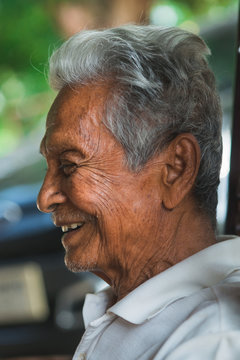 Asian old man sitting on chair