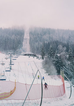 Ski trail with a ski lift in the resort Bukovel, Ukraine in winter