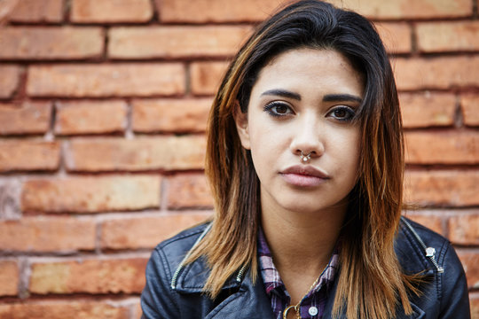Beautiful brunette girl with septum piercing.