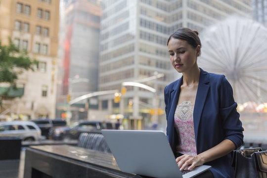 Young Businesswoman Working With a Laptop in Manhattan . New Yor