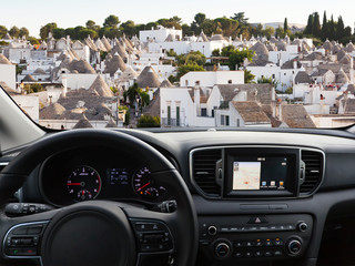 Car dashboard traveling to Alberobello