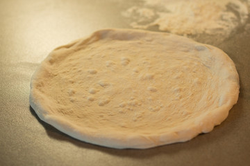 Flattened pizza base ready for topping
