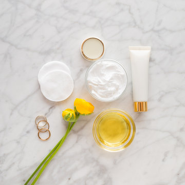 beauty and care products over marble