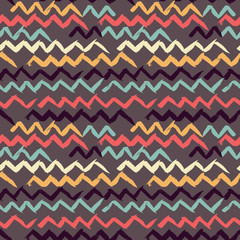 Abstract seamless hand drawn pattern. Modern grunge texture. Colorful pen-brush painted background. Texture with zigzag strokes.