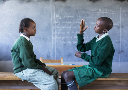 Deaf school children learning sign language