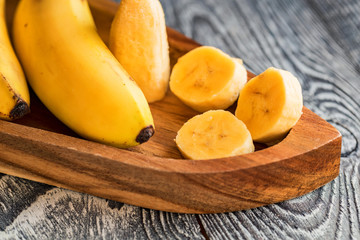 Bunch of bananas on wooden background