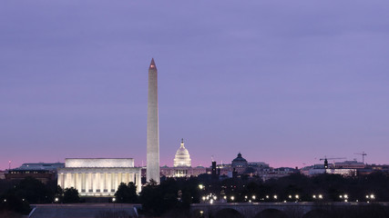 Sunrise, Lincoln Memorial, Washington Monument, and Capitol dome in Washington DC.