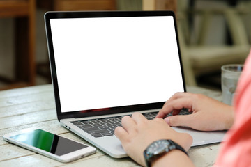 Man hands typing laptop computer with blank screen for mock up template background, business...