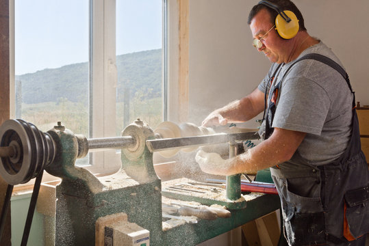 Side view of man working in carpentry workshop