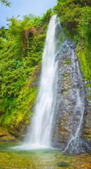 Obraz premium Beautiful Kaeng Nyui Waterfalls. Laos landscape. Vertical panorama