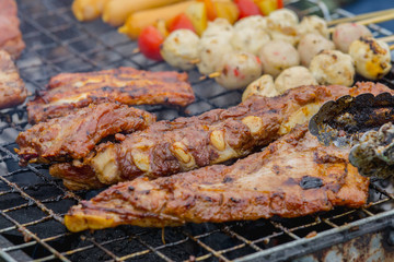 close up grilled pork ribs on the grill.