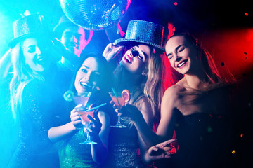 Dance party with group people . Dancing youth under influence of drugs. Women and confident casual...