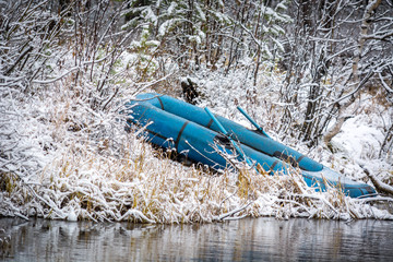 Rubber boat on the river in the winter forest