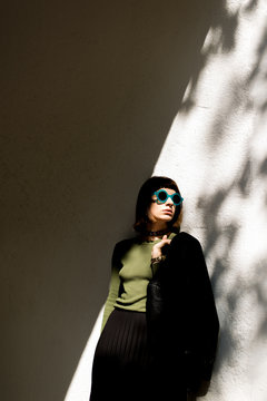 Street fashion woman in shadows
