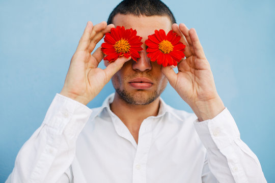 A man with red flower eyes