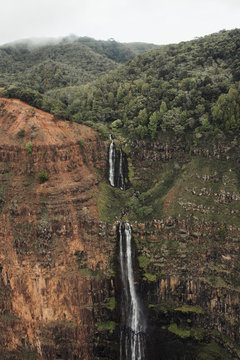 Waterfalls in Waimea Canyon helicopter images in Kauai Hawaii