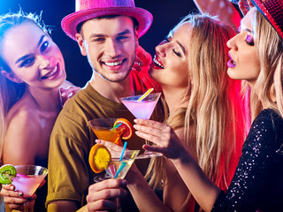 Dance party with group people dancing. How to be an alpha male at a club. Women and confident casual smiling man have fun in night club. Rest after hard day at work.