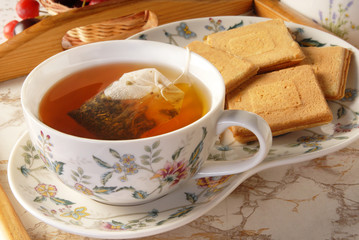 Tea bag in the cup with hot water 