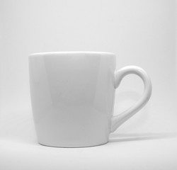 white cup on white background.