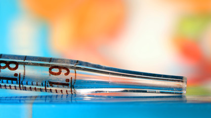 Close up shot of Pipette against colorful background