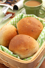 Basket full of fresh baked dinner rolls.                 