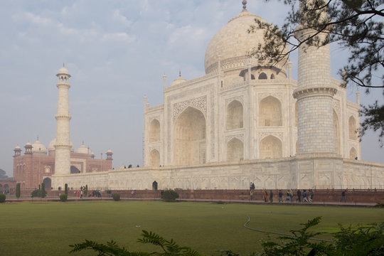 People walking around the Taj Mahal 