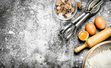 Baking background. Ingredients and tools for dough preparation.