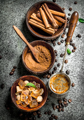 Coffee background. Coffee in turkey with crystals of sugar, cinnamon and ground coffee.