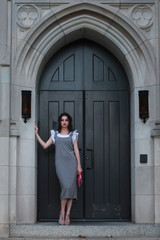 Elegant woman standing at door