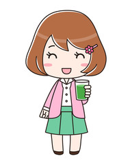 青汁入りのコップを持つ笑顔の女性