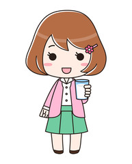 牛乳が入ったコップを持つ女性