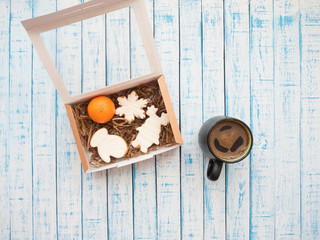 Gingerbread in packaging and coffee on an old table in French style