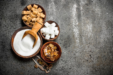 Fototapeta na wymiar Different kinds of sugar in bowls.