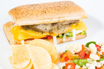 Italian grill chicken sandwich with chips and italian pickle known as giardiniera