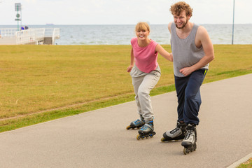 roller skater couple skating outdoor