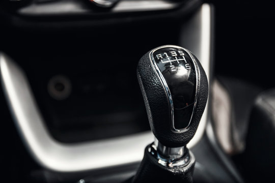 close up of gear shift in new modern car interior