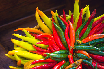 red , yellow and green chilli peppers in floating market in thailand